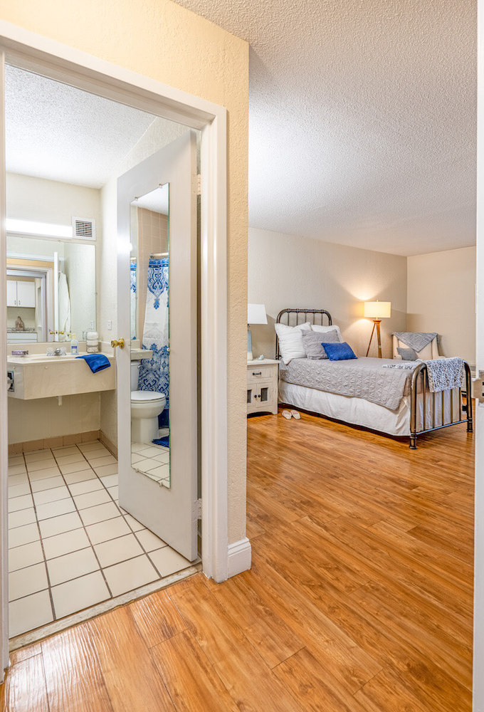 East Ridge Residence | Apartment bedroom and bathroom